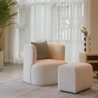 Beige fleece lounge chair with footstool - front view showing overstuffed cushioning and modern rounded design